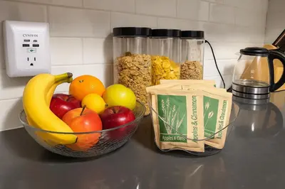 a counter with a bowl of fruit and a jar of cereal at Tropical style room in Geusthouse in New York