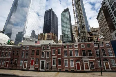 a red brick building in a city with tall buildings at FiDi Studio w Gym Lounge Complete Gym NYC-499 in New York