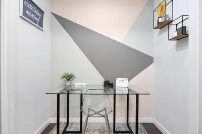 a glass table and a chair in a room at SWJ Whole Bldg - Largest Place in NYC_21 Beds_6 apts in New York