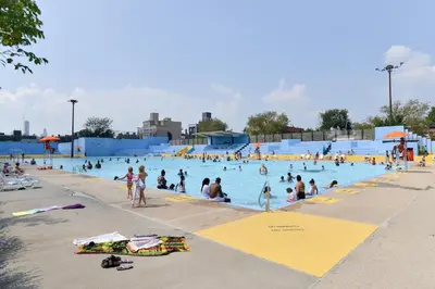 a group of people in a pool at a water park at Tuk Ahoy - Emerald Suite 2C with Shared Spaces in Brooklyn