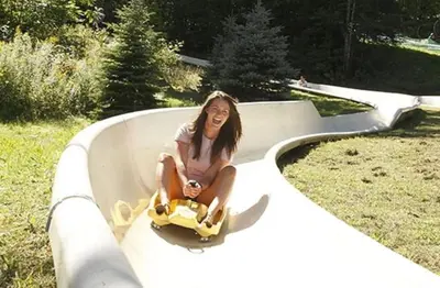 a young woman sitting in a bath tub at 1st Floor Mountain View Suite Ski On Off At Jiminy- Fully Redone Decor in Hancock