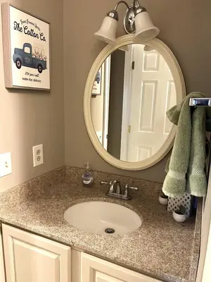 a bathroom with a sink and a mirror at 1st Floor Mountain View Suite Ski On Off At Jiminy- Fully Redone Decor in Hancock