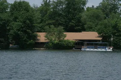 a house in the middle of a lake at Cabin Chalet - Breathtaking Cabin in Laurel Island in East Hampton