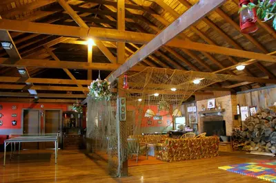 a large room with a wooden ceiling with wooden floors at Cabin Chalet - Breathtaking Cabin in Laurel Island in East Hampton