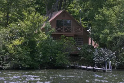 a house on the banks of a river at Cabin Chalet - Breathtaking Cabin in Laurel Island in East Hampton