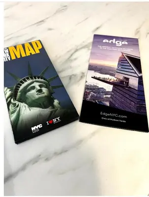 two magazines on a table with the statue of liberty at 4-A Diamond in Yonkers in Yonkers