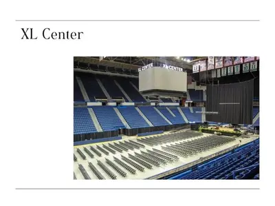 an empty stadium with blue seats in it at XL Center 1-BR Condo DWNTN Hartford Easy Parking in Hartford