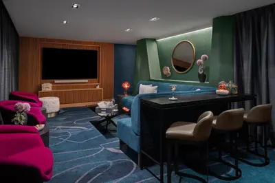a living room with a blue couch and a tv at Financial District 1br w WD gym elevator NYC-1378 in New York