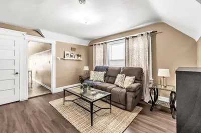 a living room with a couch and a table at A walk to Yale Bridgeport Hospital in Bridgeport