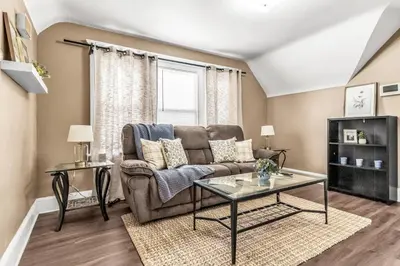 a living room with a couch and a table at A walk to Yale Bridgeport Hospital in Bridgeport