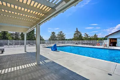 an outdoor swimming pool with a pergola at Ski, Sip and Snuggle Cozy Catskills Gem with Views! in Athens