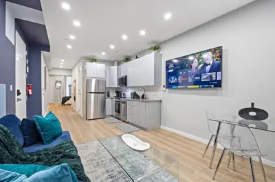 a living room with a couch and a table at SWJ544 - Chic 1BR in the Heart of NYC in New York