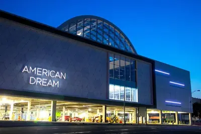 an american dream building at night at Sage Stay by the Train, We Pay Half Your Parking, 2 Queen Beds plus Sleeps 6 in Hoboken