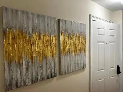 three paintings hanging on a wall next to a door at 9-A Diamond in Yonkers, NY in Yonkers