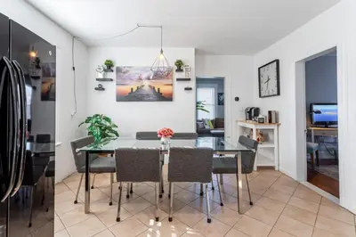 a dining room with a glass table and chairs at Spacious&Gracious- 5BR Fam-Friendly near I95&Shops in Fairfield