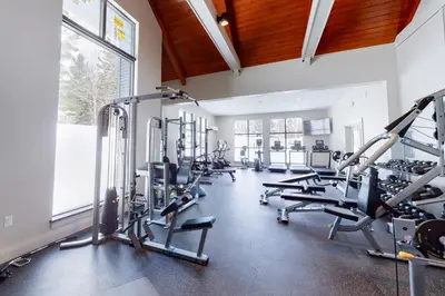 a gym with treadmills and cardio equipment in a building at The Seasons G27 in Dover