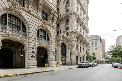 a large building with cars parked on a city street at Blueground Upper West Side ac wd NYC-1546 in New York