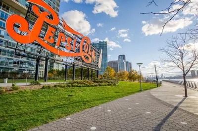 a large orange sign in front of a building at Blueground Long Island City 1bd apartment NYC-1612 in New York