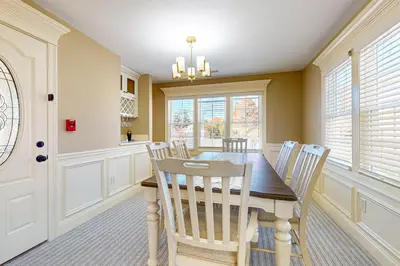 a dining room with a wooden table and chairs at Near Medical Center! Remote-Work Hub in Holyoke in Holyoke