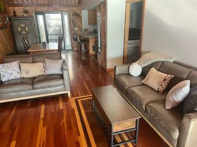 a living room with two couches and a table at Lake Moraine Home #7 Near Colgate University in Hamilton