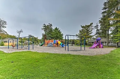 a park with a playground with a slide at 1 floor, Pocono Pond house with Game Room in Tobyhanna
