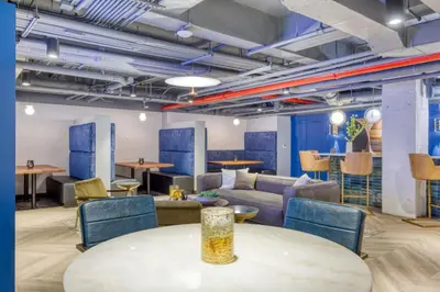 a living room with a table and chairs at Blueground Boerum Hill gym wd nr sports NYC-1573 in New York