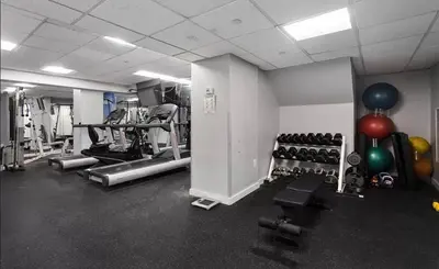 a gym with lots of exercise equipment and balloons at 73-812 New Studio UWS Doorman Gym in New York