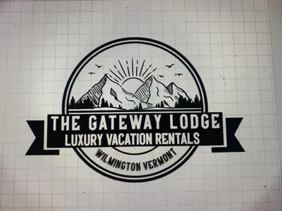 a logo for the gateway lodge luxury vacation rentals at Luxury TownHome 106 in Wilmington
