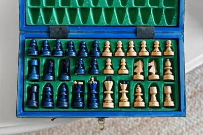 a chess set in a blue box with chess pieces at Ski In Ski Out Hunter Mtn Seasonal Pool Access w Panoramic Views Hike Swim Fish Unwind in Lanesville