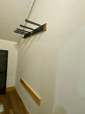 a white wall with a shelf on the wall at Luxury Townhome 107 in Wilmington