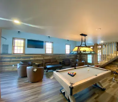a living room with a pool table in it at Luxury Townhome 107 in Wilmington