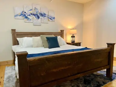 a bedroom with a large bed in a room at Luxury Townhome 107 in Wilmington