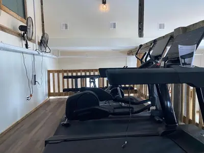 a gym with tread machines in a room at Luxury Townhome 105 in Wilmington