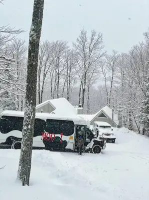 a bus parked in a snow covered yard at 6BD 3BA - Mount Snow VT - Ski-Back Trail - Shuttle in Dover