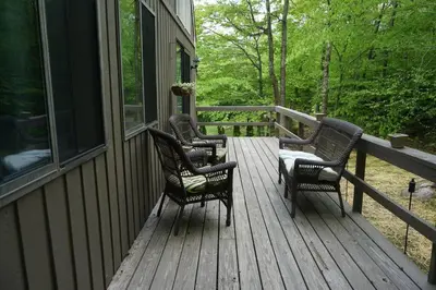 three rocking chairs sitting on a porch of a house at 6BD 3BA - Mount Snow VT - Ski-Back Trail - Shuttle in Dover