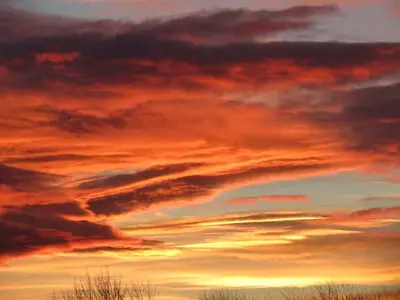 a sunset in the sky with clouds at Unique Vacation Rental on a Working Farm near Hudson, New York in Hudson