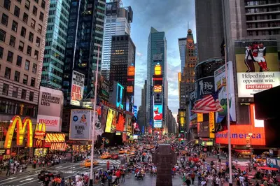 a busy city street with a crowd of people at Private room by Times Square Manhattan in New York
