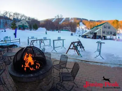 a fire pit with a playground in the snow at 2 BR JIMINY PEAK w Mountain Views SLEEPS 7 Gorgeous in Hancock