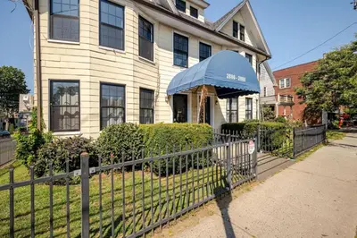 a house with a fence in front of it at Modern 2 Bed in BlackRock in Bridgeport