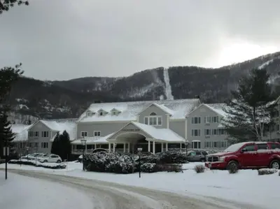 a large house with snow on the roof at Luxury Jiminy Ski On Off Village Ctr Condo Sleeps4 in Hancock