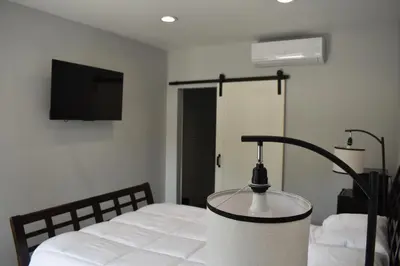 a bedroom with a bed with a lamp on it at Tannersville Village Room 1 in Tannersville