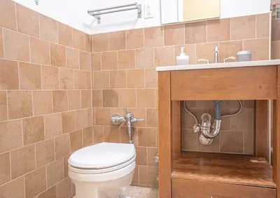 a bathroom with a toilet and a sink at Charming Upper East Side W Outdoor Space in New York