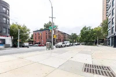 an empty street in a city with cars parked at Blueground Clinton Hill rooftop nr Fort Greene Park NYC-1979 in Brooklyn