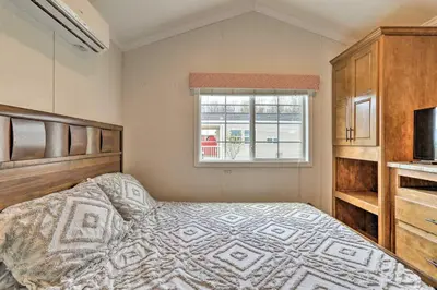 a bedroom with a bed and a window at Premium Cottages And Suites At Equestrian House in Pleasant Mount