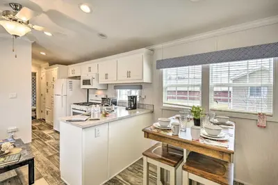 a kitchen with white cabinets and a counter top at Premium Cottages And Suites At Equestrian House in Pleasant Mount
