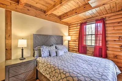 a bedroom with a bed and a window at Family Cabin and Suite Near Elk Mountain Ski Slopes in Pleasant Mount