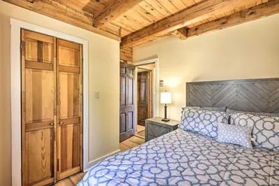 a bedroom with a bed and a wooden ceiling at Family Cabin and Suites Close to Ski Adventures in Pleasant Mount
