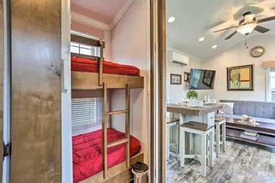 a room with bunk beds in a tiny house at Tranquil Trails Cabin & Suites Near Ski Area in Pleasant Mount