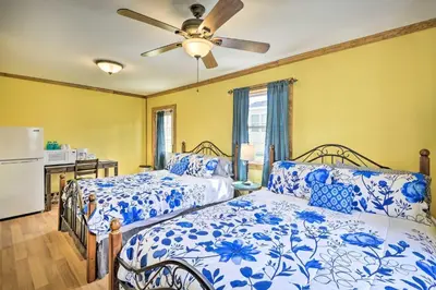a bedroom with two beds and a ceiling fan at Countryside Retreat Close to Ski Slopes in Pleasant Mount