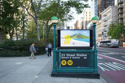 a sign on the side of a street with a bus at Blueground Chelsea fitness center nr Madison Square Park NYC-390 in New York